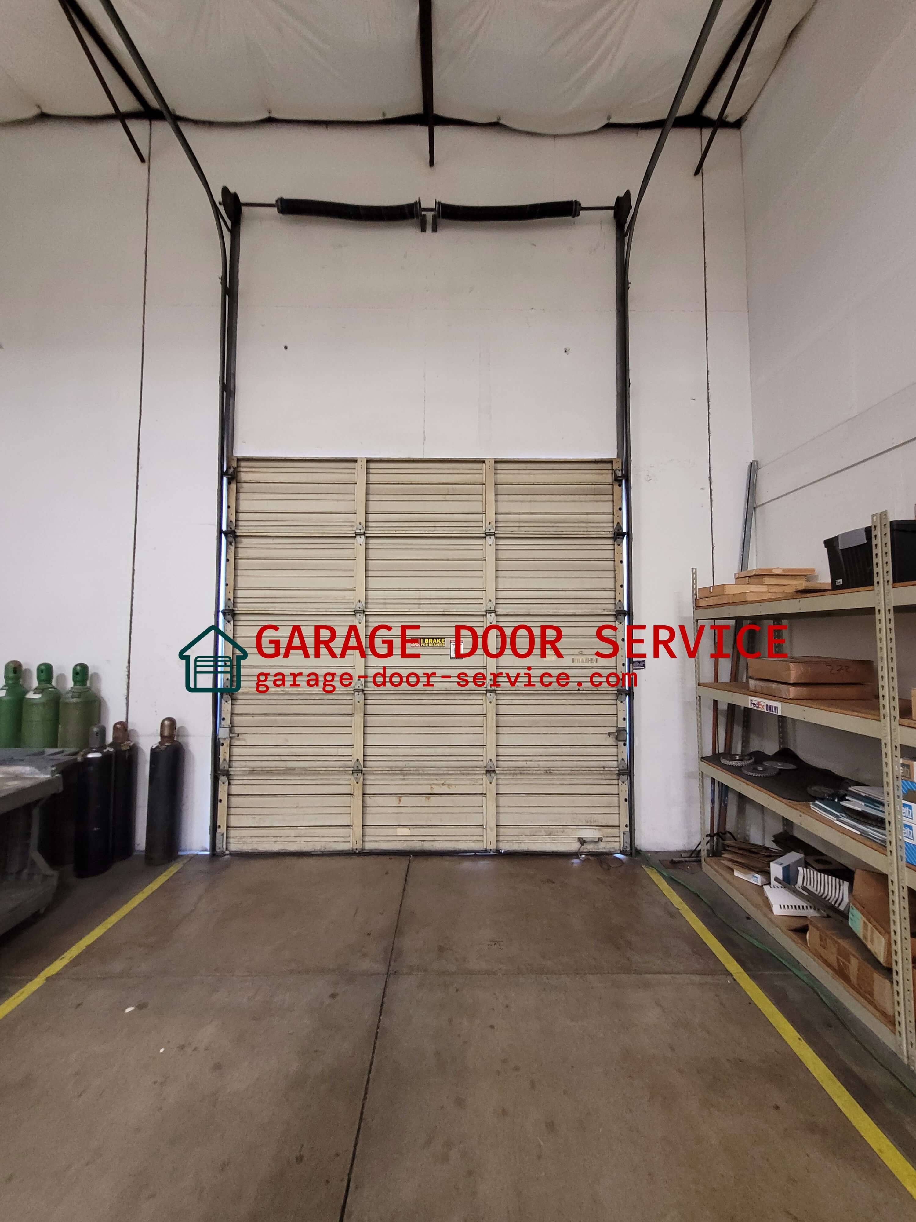 garage-door-service.com_vertical_lift_commercial_garage_door_spring_Replacement